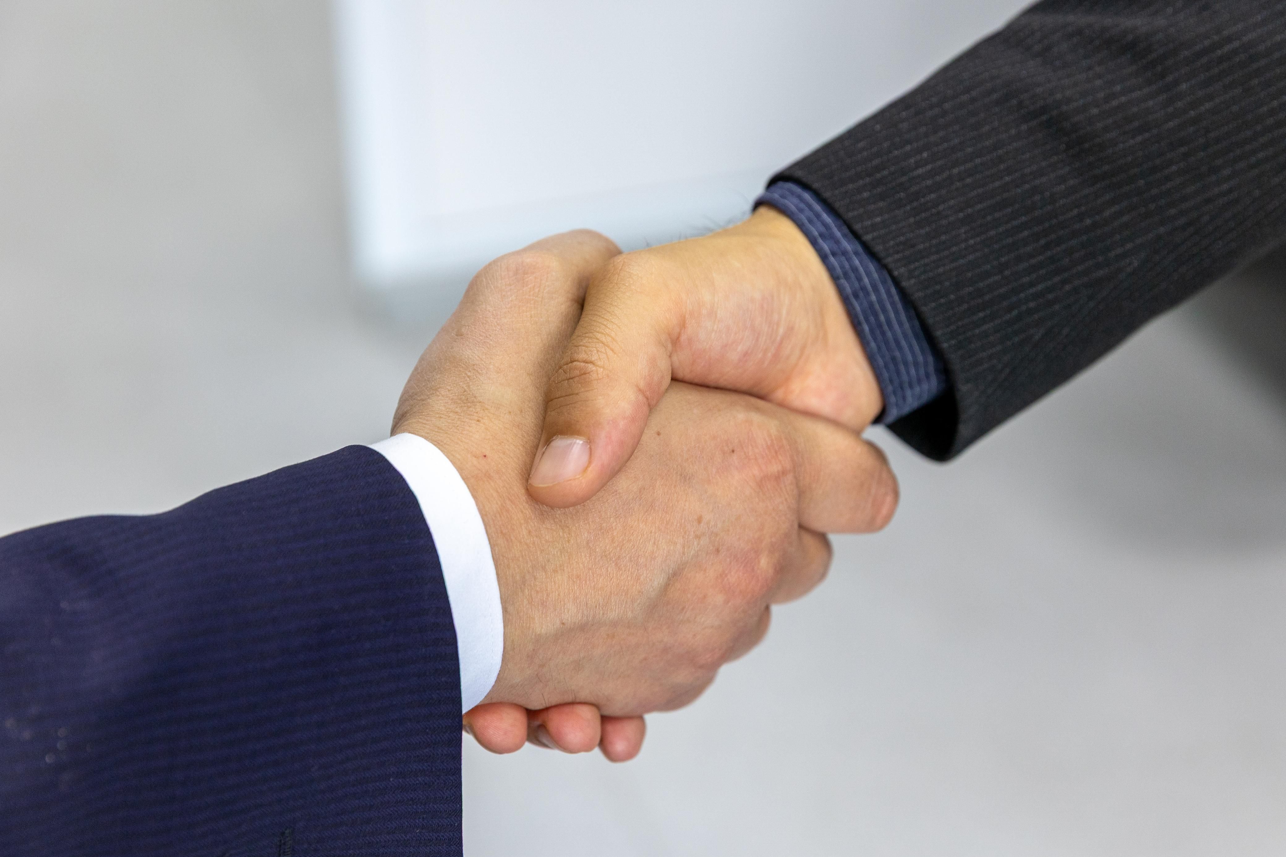 Business handshake — partnership in international trade